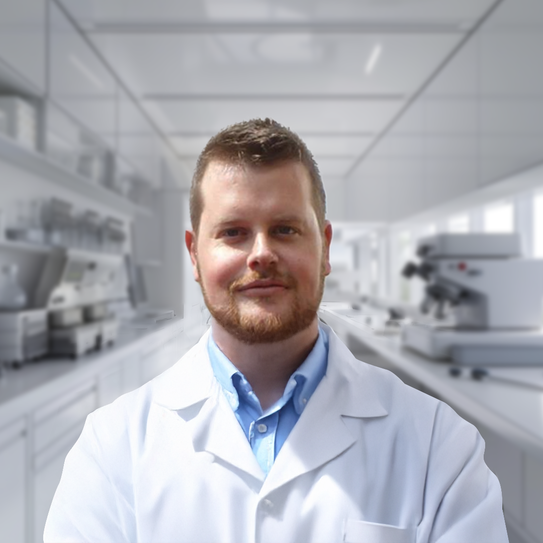 Dr Burgert Blom in a laboratory, wearing a white lab coat